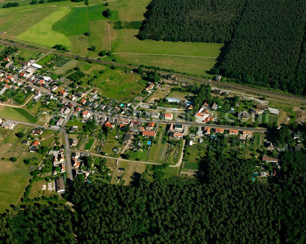 Aerial photograph Nedlitz - Agricultural land and field boundaries surround the settlement area of the village in Nedlitz in the state Saxony-Anhalt, Germany