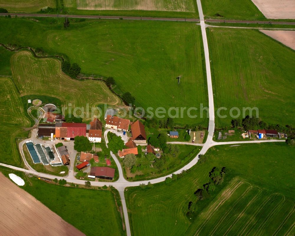 Aerial photograph Neidlingen - Agricultural land and field boundaries surround the settlement area of the village in Neidlingen in the state Bavaria, Germany