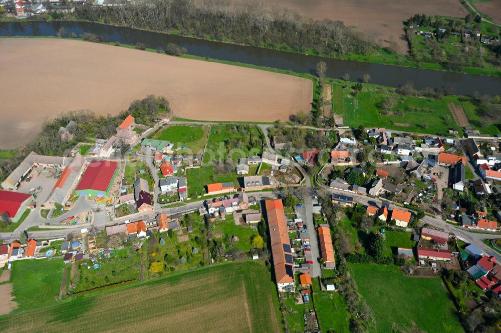 Nelben from above - Agricultural land and field boundaries surround the settlement area of the village in Nelben in the state Saxony-Anhalt, Germany