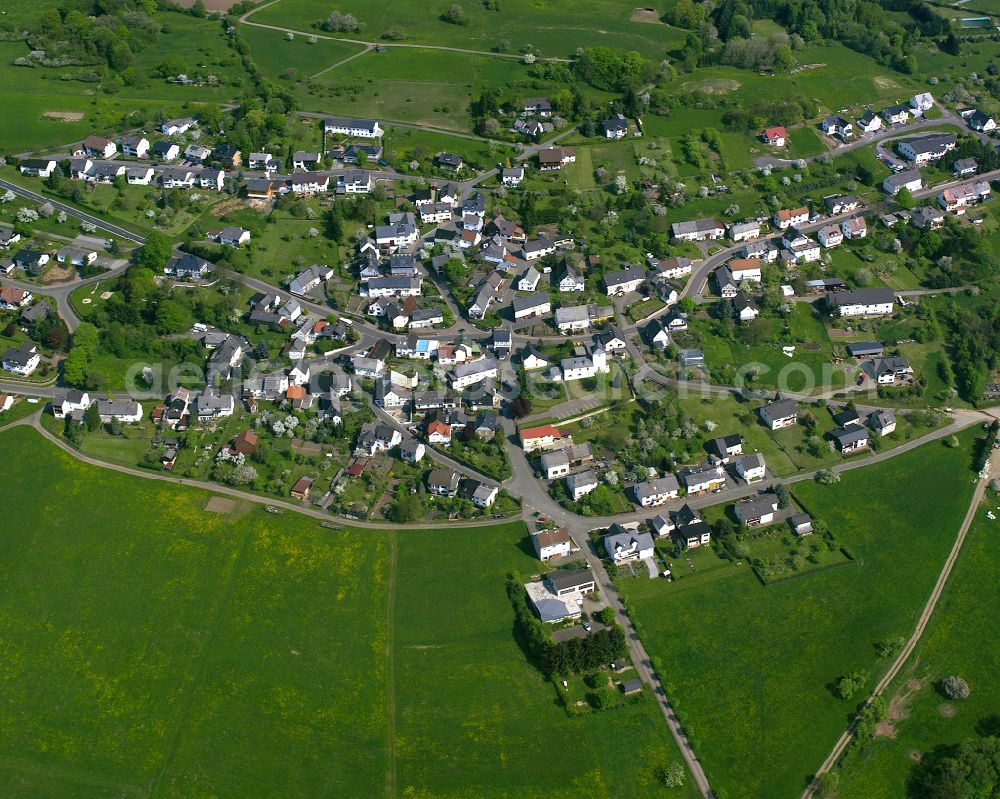 Nenderoth from above - Agricultural land and field boundaries surround the settlement area of the village in Nenderoth in the state Hesse, Germany