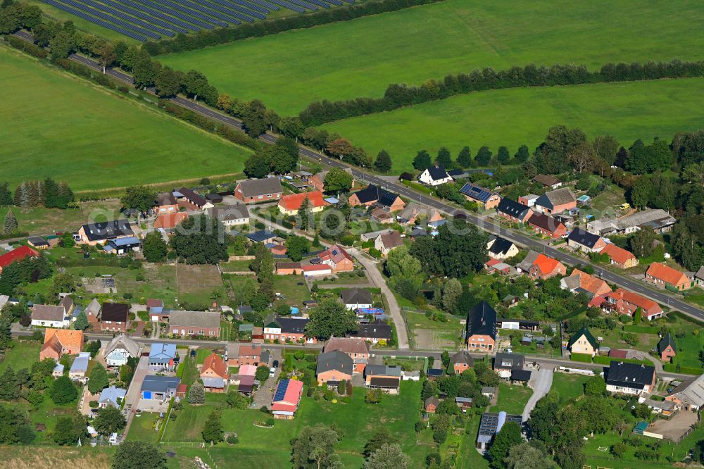 Neu Brenz from above - Agricultural land and field boundaries surround the settlement area of the village in Neu Brenz in the state Mecklenburg - Western Pomerania, Germany