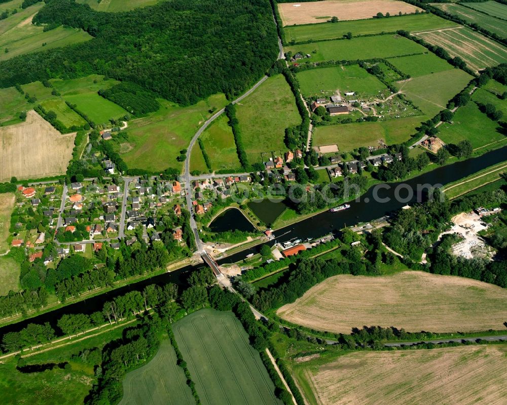 Neu-Lankau from above - Agricultural land and field boundaries surround the settlement area of the village in Neu-Lankau in the state Schleswig-Holstein, Germany