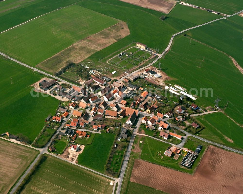 Aerial photograph Neudorf - Agricultural land and field boundaries surround the settlement area of the village in Neudorf in the state Bavaria, Germany