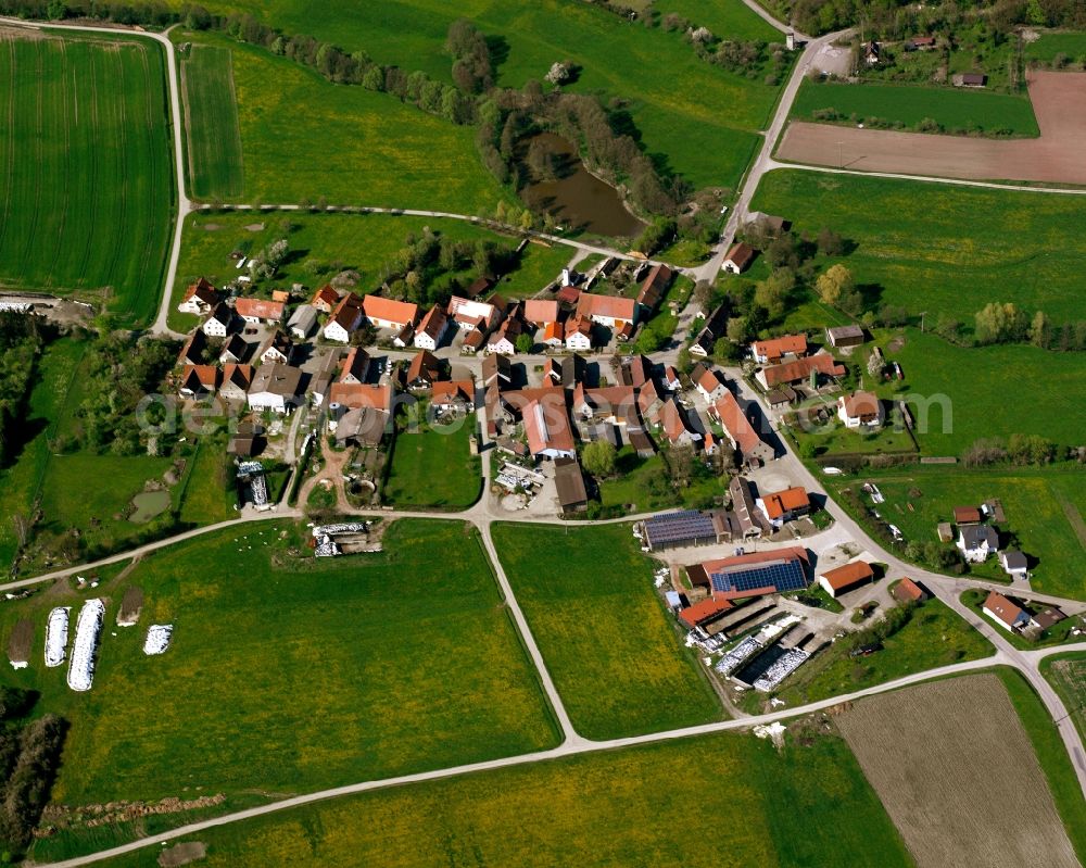 Aerial image Neudorf - Agricultural land and field boundaries surround the settlement area of the village in Neudorf in the state Bavaria, Germany