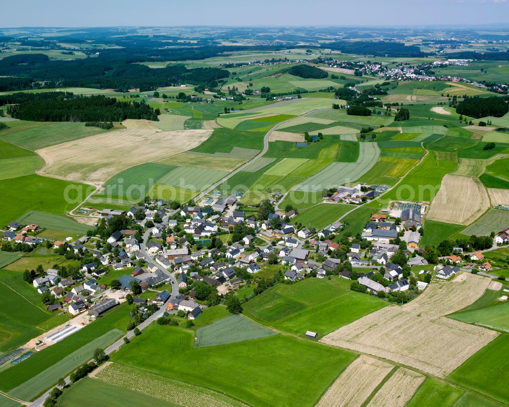 Aerial photograph Neudorf - Agricultural land and field boundaries surround the settlement area of the village in Neudorf in the state Bavaria, Germany