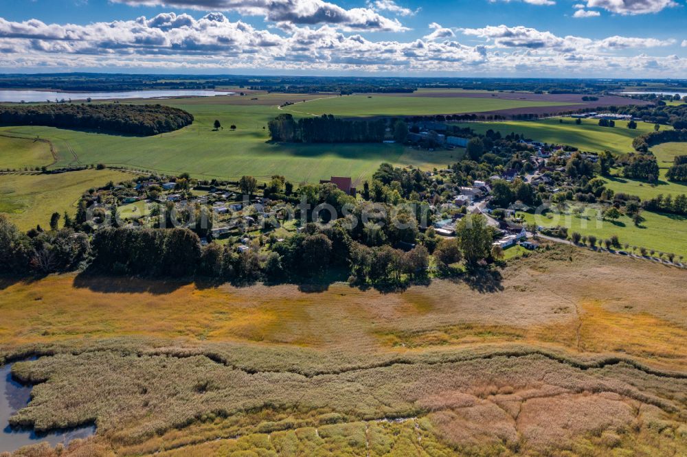 Neuenkirchen from above - Agricultural land and field boundaries surround the settlement area of the village on street Klein Grubnow in Neuenkirchen in the state Mecklenburg - Western Pomerania, Germany