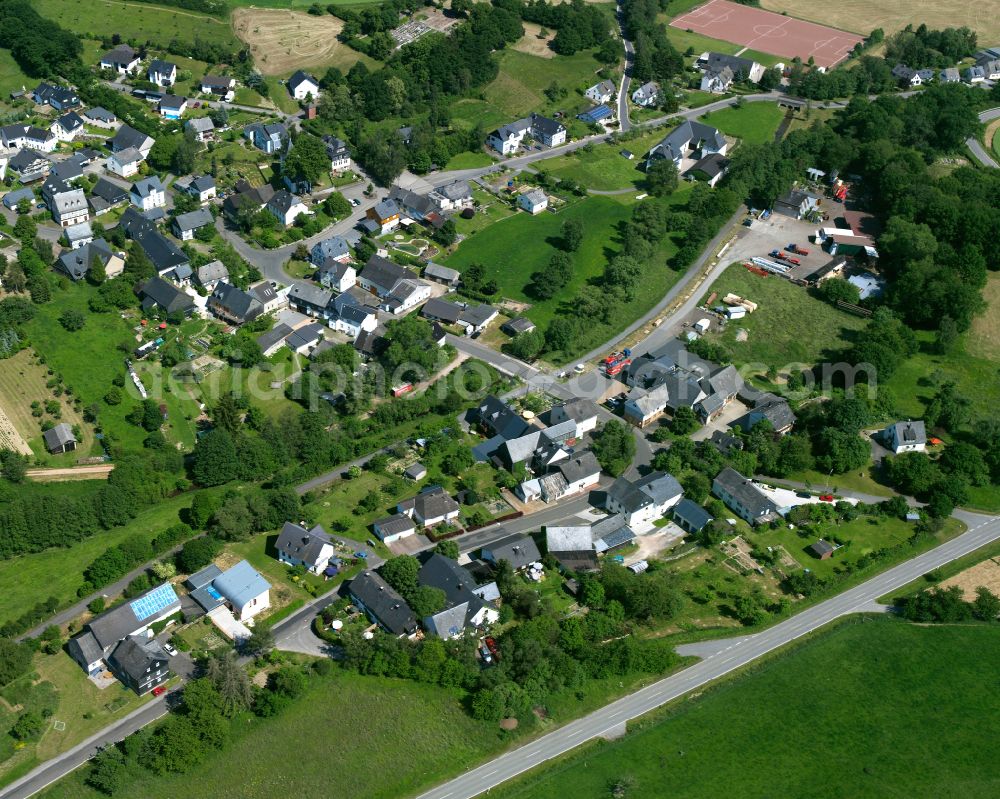 Neuerkirch from the bird's eye view: Agricultural land and field boundaries surround the settlement area of the village in Neuerkirch in the state Rhineland-Palatinate, Germany