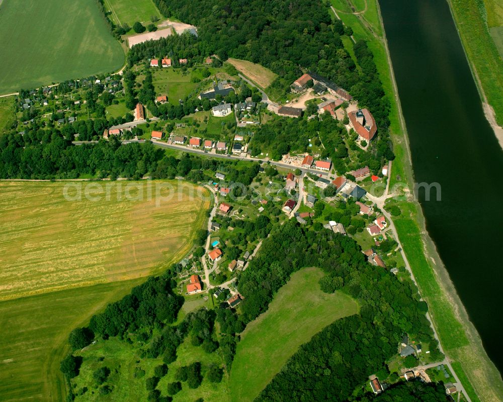 Neuhirschstein from above - Agricultural land and field boundaries surround the settlement area of the village in Neuhirschstein in the state Saxony, Germany