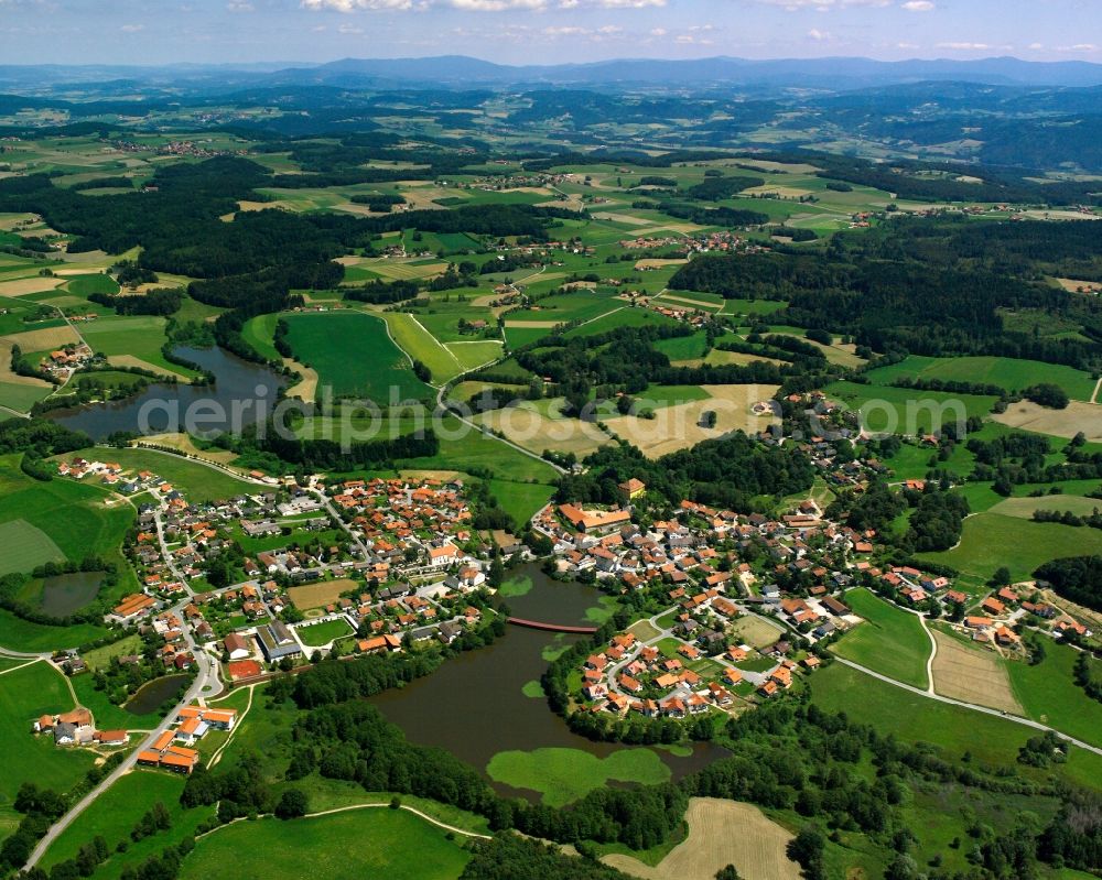 Aerial photograph Neumühle - Agricultural land and field boundaries surround the settlement area of the village in Neumühle in the state Bavaria, Germany