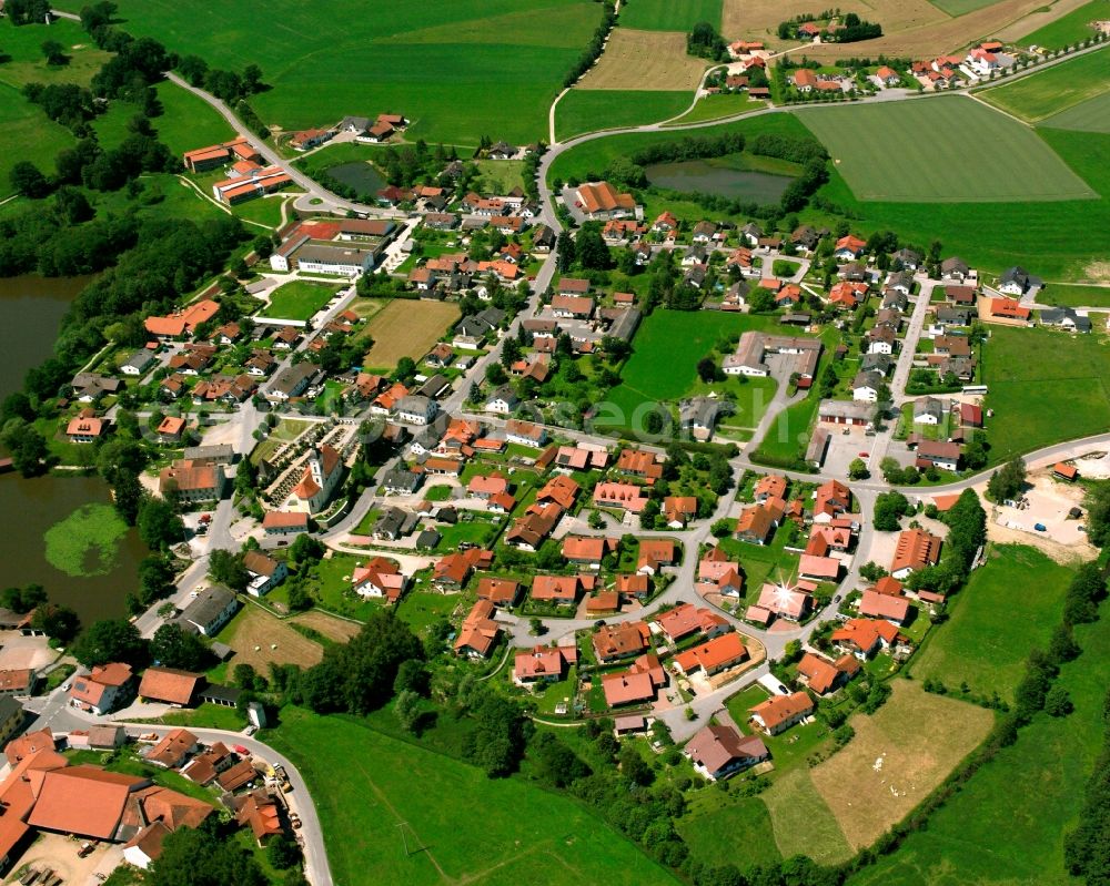 Aerial image Neumühle - Agricultural land and field boundaries surround the settlement area of the village in Neumühle in the state Bavaria, Germany