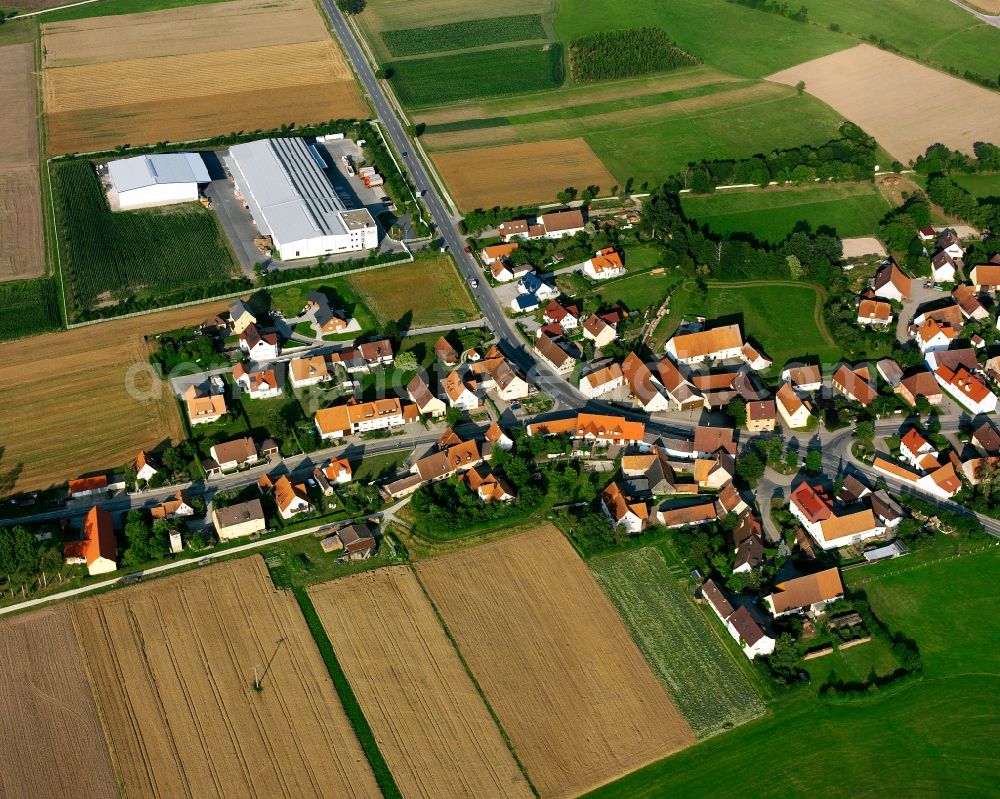 Aerial photograph Neunstetten - Agricultural land and field boundaries surround the settlement area of the village in Neunstetten in the state Bavaria, Germany