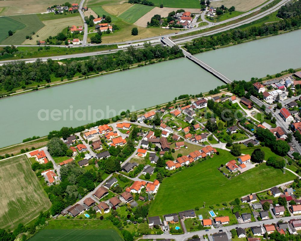 Aerial photograph Neuötting - Agricultural land and field boundaries surround the settlement area of the village in Neuötting in the state Bavaria, Germany