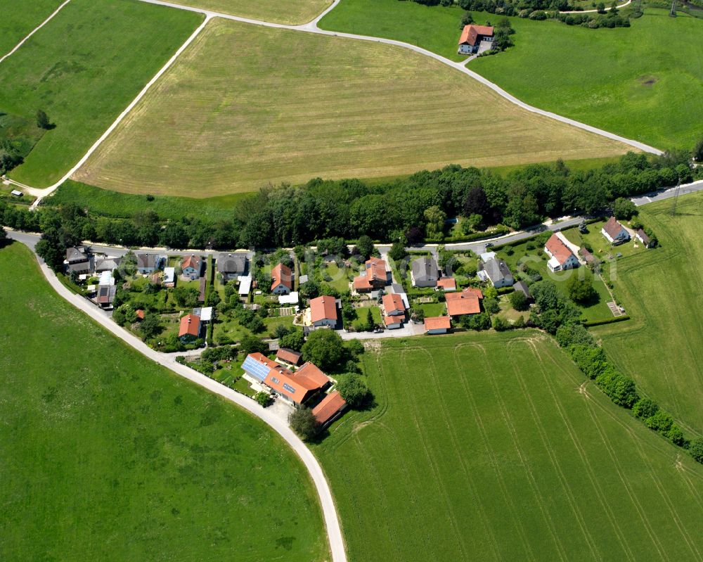 Neuötting from above - Agricultural land and field boundaries surround the settlement area of the village in Neuötting in the state Bavaria, Germany