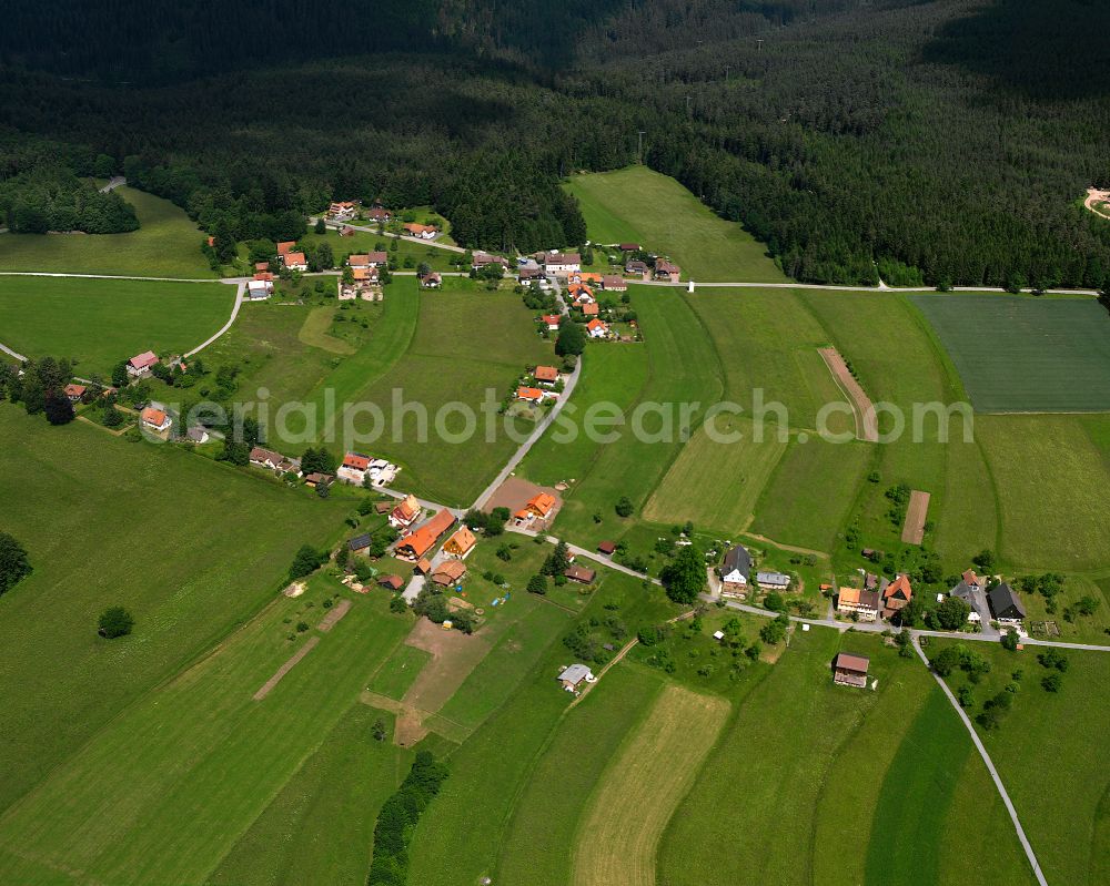 Aerial photograph Neuweiler - Agricultural land and field boundaries surround the settlement area of the village in Neuweiler in the state Baden-Wuerttemberg, Germany