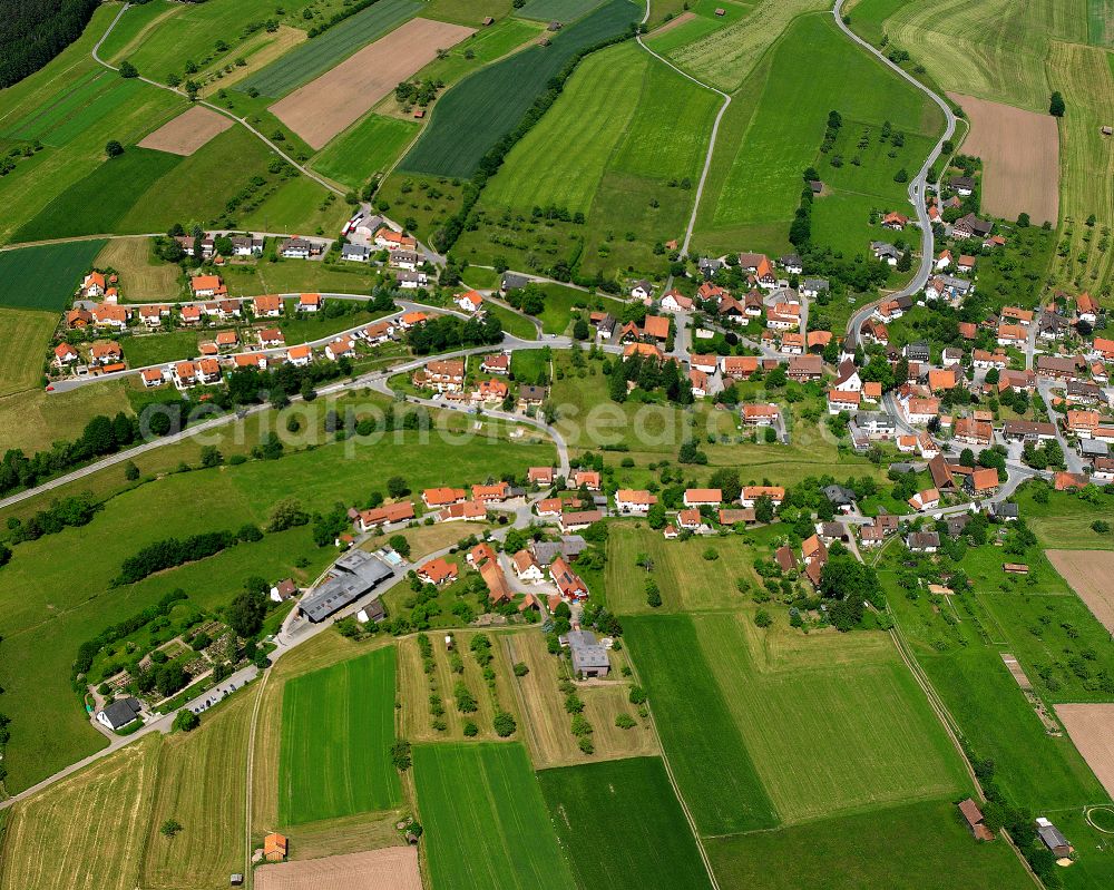 Aerial image Neuweiler - Agricultural land and field boundaries surround the settlement area of the village in Neuweiler in the state Baden-Wuerttemberg, Germany