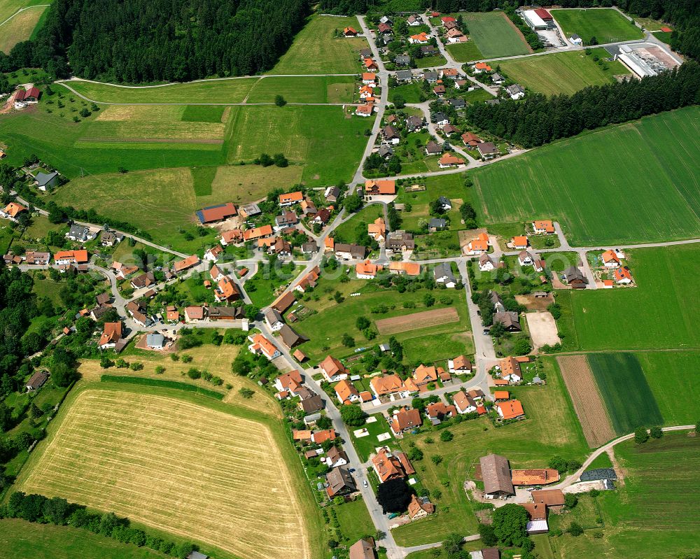 Neuweiler from the bird's eye view: Agricultural land and field boundaries surround the settlement area of the village in Neuweiler in the state Baden-Wuerttemberg, Germany