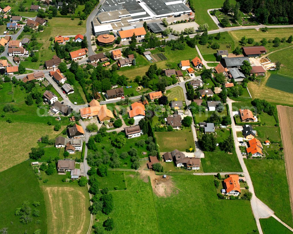 Neuweiler from the bird's eye view: Agricultural land and field boundaries surround the settlement area of the village in Neuweiler in the state Baden-Wuerttemberg, Germany