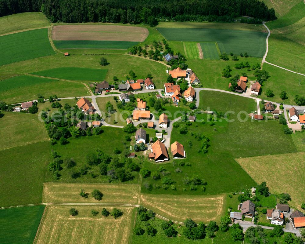 Aerial photograph Neuweiler - Agricultural land and field boundaries surround the settlement area of the village in Neuweiler in the state Baden-Wuerttemberg, Germany