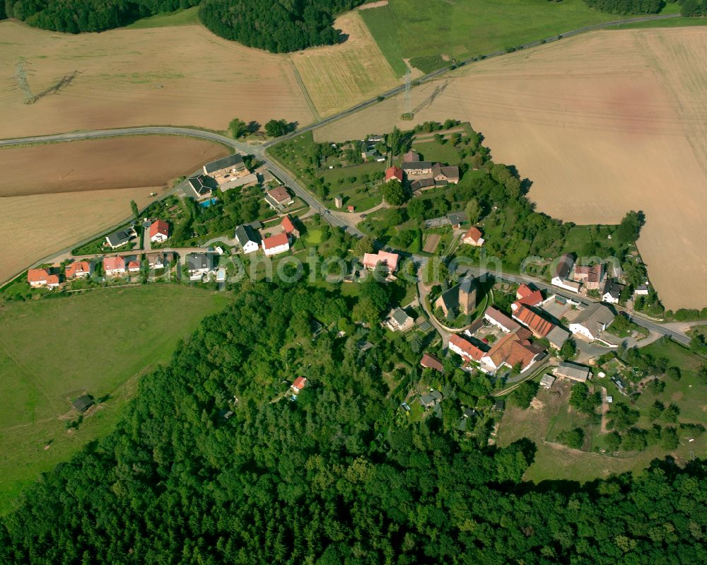 Aerial image Niebra - Agricultural land and field boundaries surround the settlement area of the village in Niebra in the state Thuringia, Germany