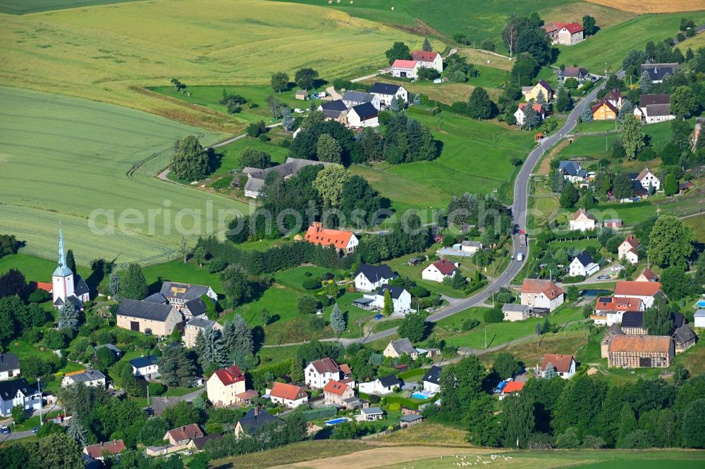 Niederelsdorf from above - Agricultural land and field boundaries surround the settlement area of the village in Niederelsdorf in the state Saxony, Germany