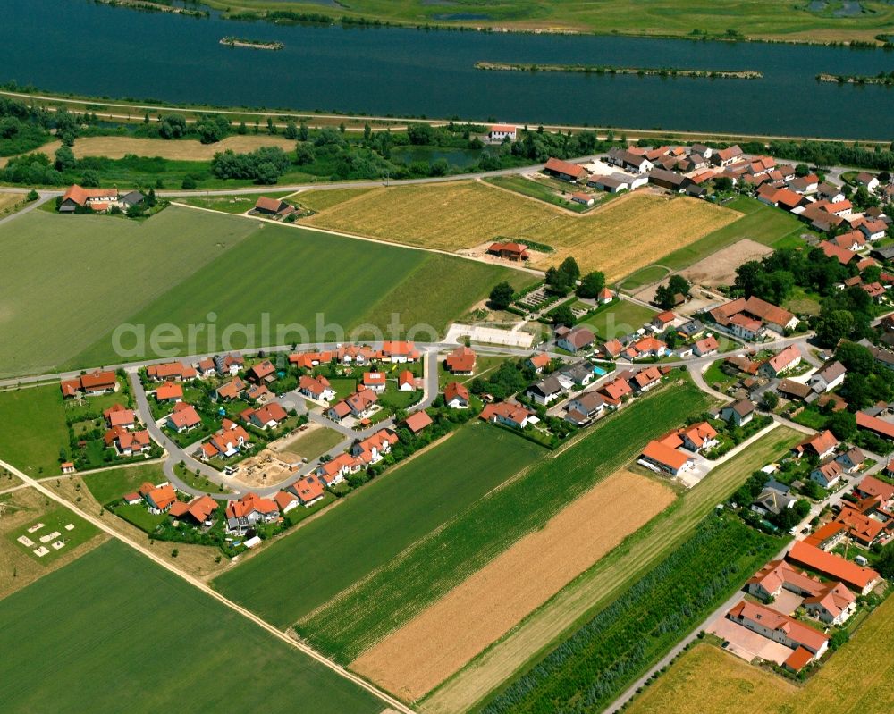 Niedermotzing from above - Agricultural land and field boundaries surround the settlement area of the village in Niedermotzing in the state Bavaria, Germany