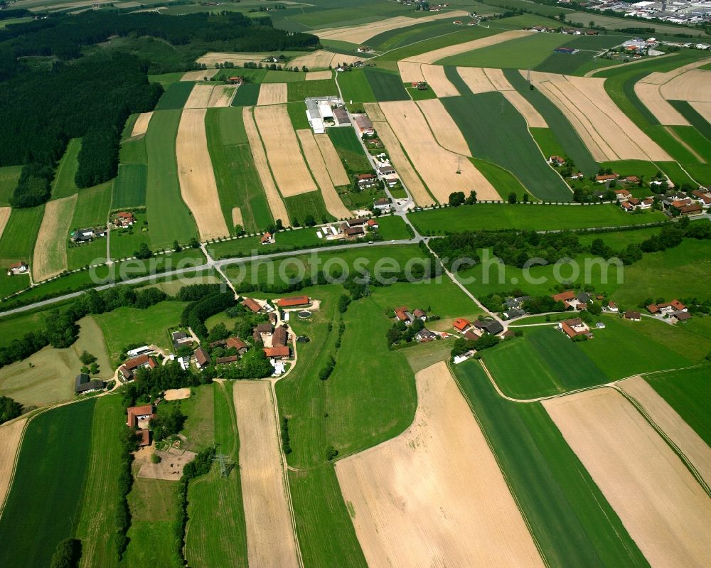 Aerial image Niederndorf - Agricultural land and field boundaries surround the settlement area of the village in Niederndorf in the state Bavaria, Germany