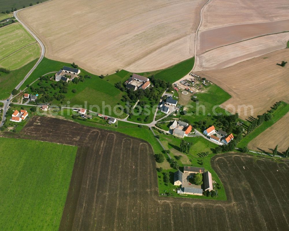 Niedersteinbach from above - Agricultural land and field boundaries surround the settlement area of the village in Niedersteinbach in the state Saxony, Germany