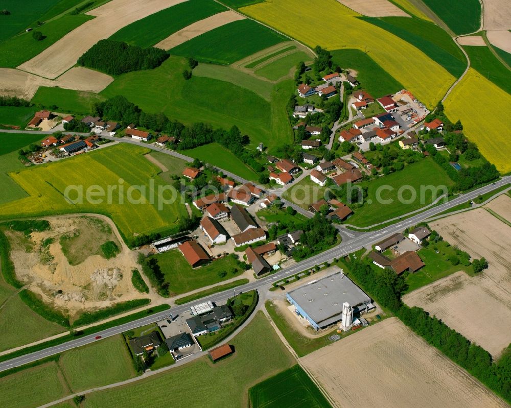 Nindorf from the bird's eye view: Agricultural land and field boundaries surround the settlement area of the village in Nindorf in the state Bavaria, Germany