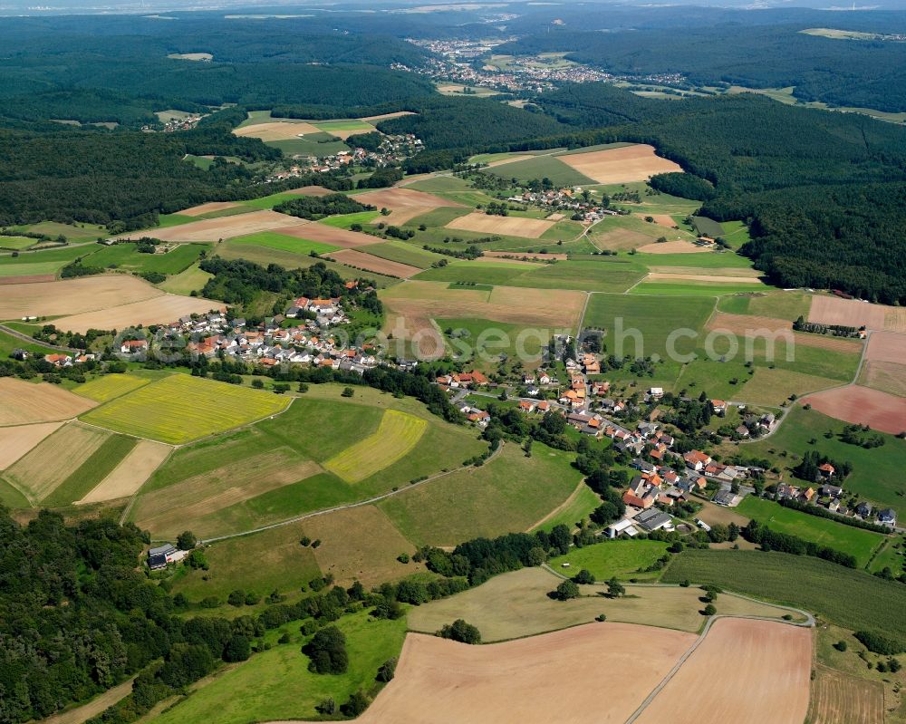 Aerial image Ober-Kinzig - Agricultural land and field boundaries surround the settlement area of the village in Ober-Kinzig in the state Hesse, Germany