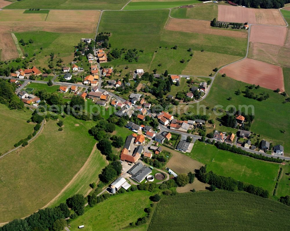 Aerial photograph Ober-Kinzig - Agricultural land and field boundaries surround the settlement area of the village in Ober-Kinzig in the state Hesse, Germany