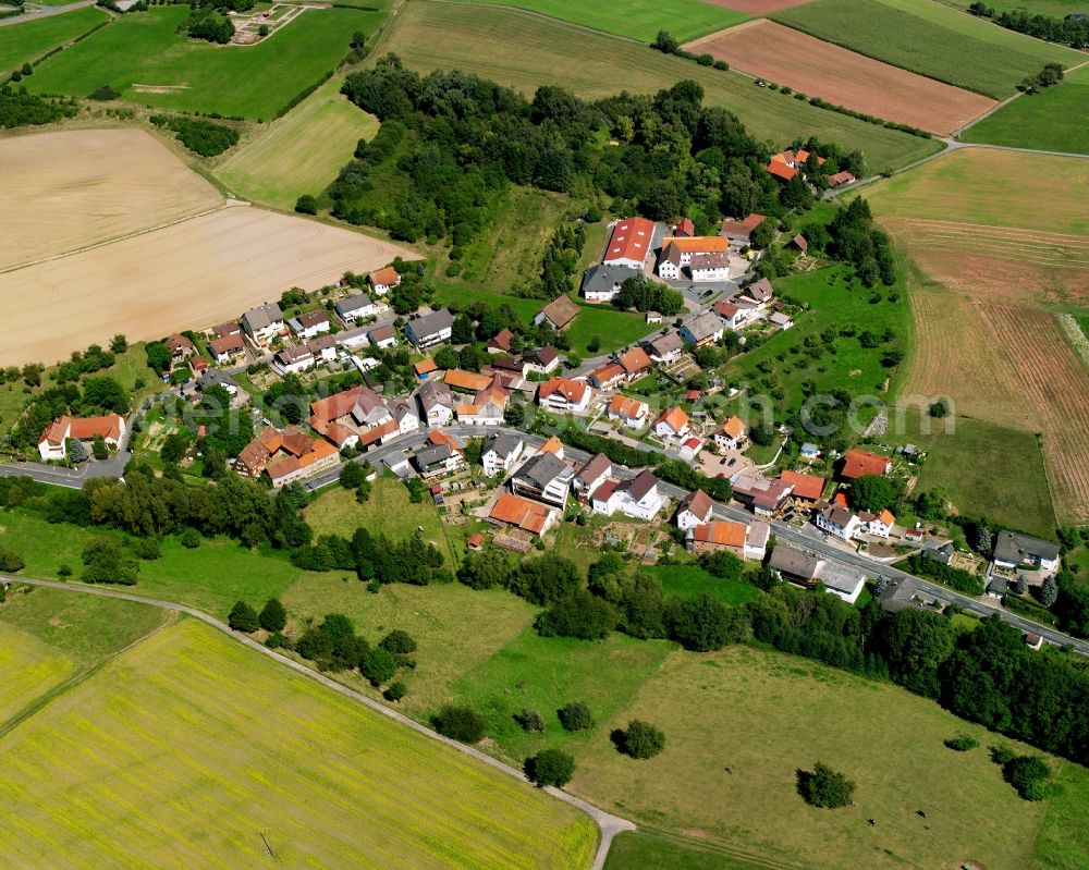 Ober-Kinzig from above - Agricultural land and field boundaries surround the settlement area of the village in Ober-Kinzig in the state Hesse, Germany