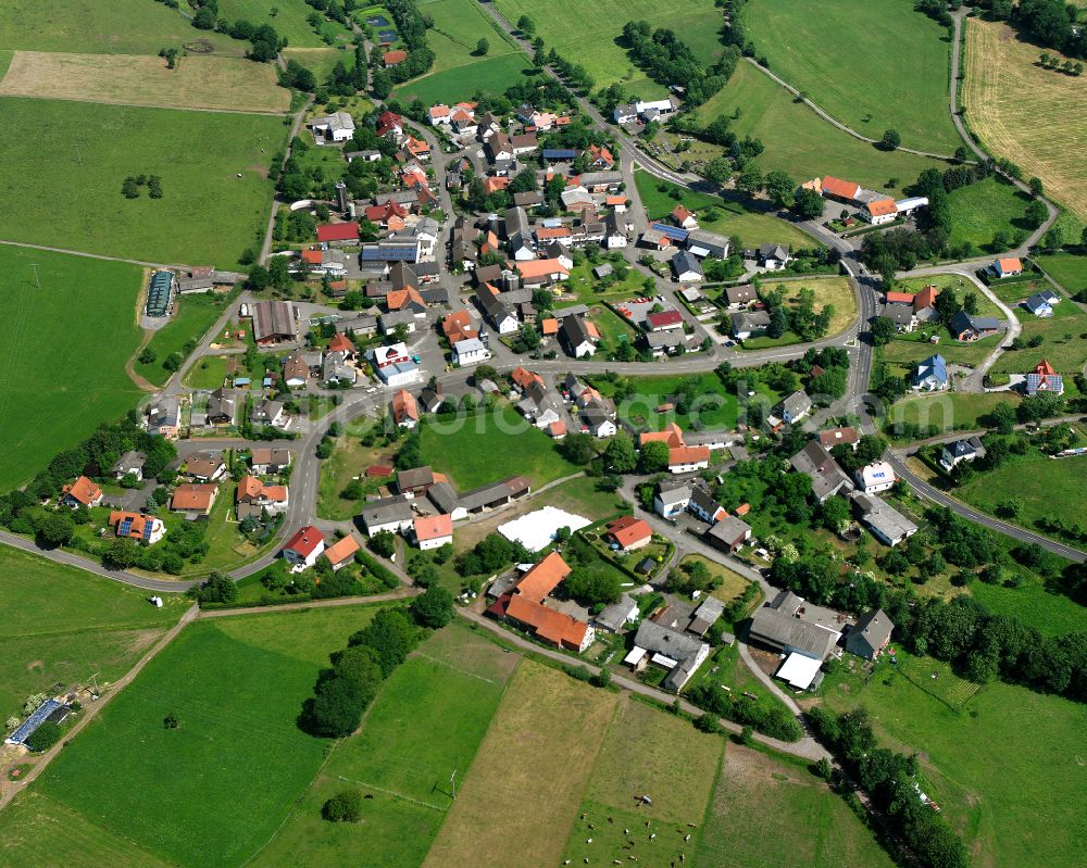 Aerial photograph Ober-Seibertenrod - Agricultural land and field boundaries surround the settlement area of the village in Ober-Seibertenrod in the state Hesse, Germany