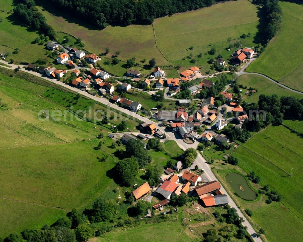 Aerial image Ober-Sensbach - Agricultural land and field boundaries surround the settlement area of the village in Ober-Sensbach in the state Hesse, Germany