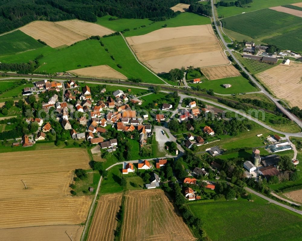 Oberampfrach from the bird's eye view: Agricultural land and field boundaries surround the settlement area of the village in Oberampfrach in the state Bavaria, Germany