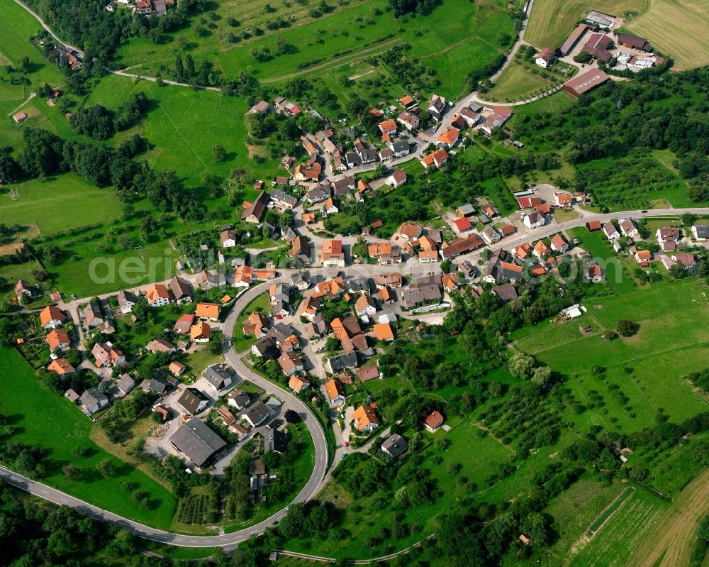 Oberheimbach from the bird's eye view: Agricultural land and field boundaries surround the settlement area of the village in Oberheimbach in the state Baden-Wuerttemberg, Germany