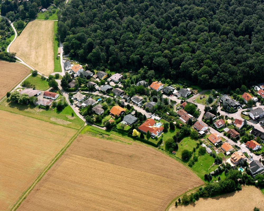 Oberheinriet from above - Agricultural land and field boundaries surround the settlement area of the village in Oberheinriet in the state Baden-Wuerttemberg, Germany