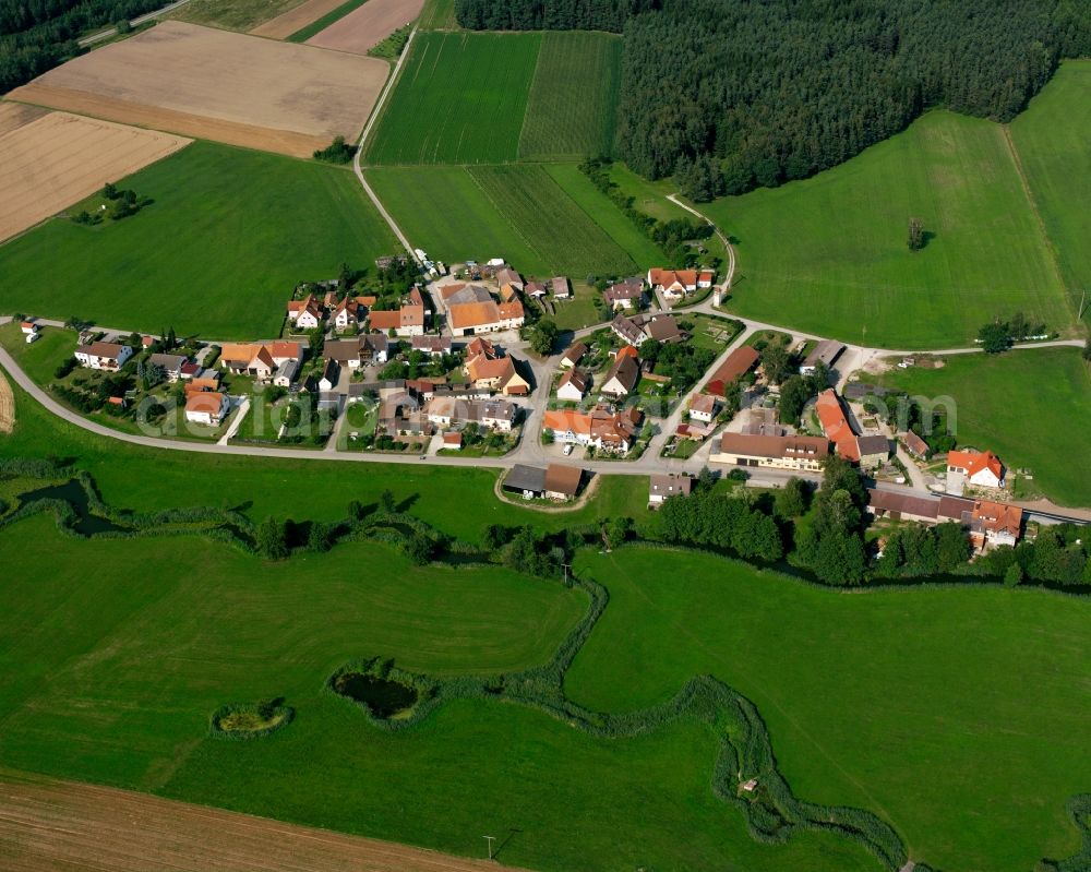 Oberkemmathen from above - Agricultural land and field boundaries surround the settlement area of the village in Oberkemmathen in the state Bavaria, Germany