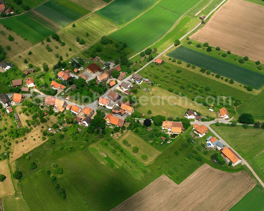 Oberkollwangen from above - Agricultural land and field boundaries surround the settlement area of the village in Oberkollwangen in the state Baden-Wuerttemberg, Germany