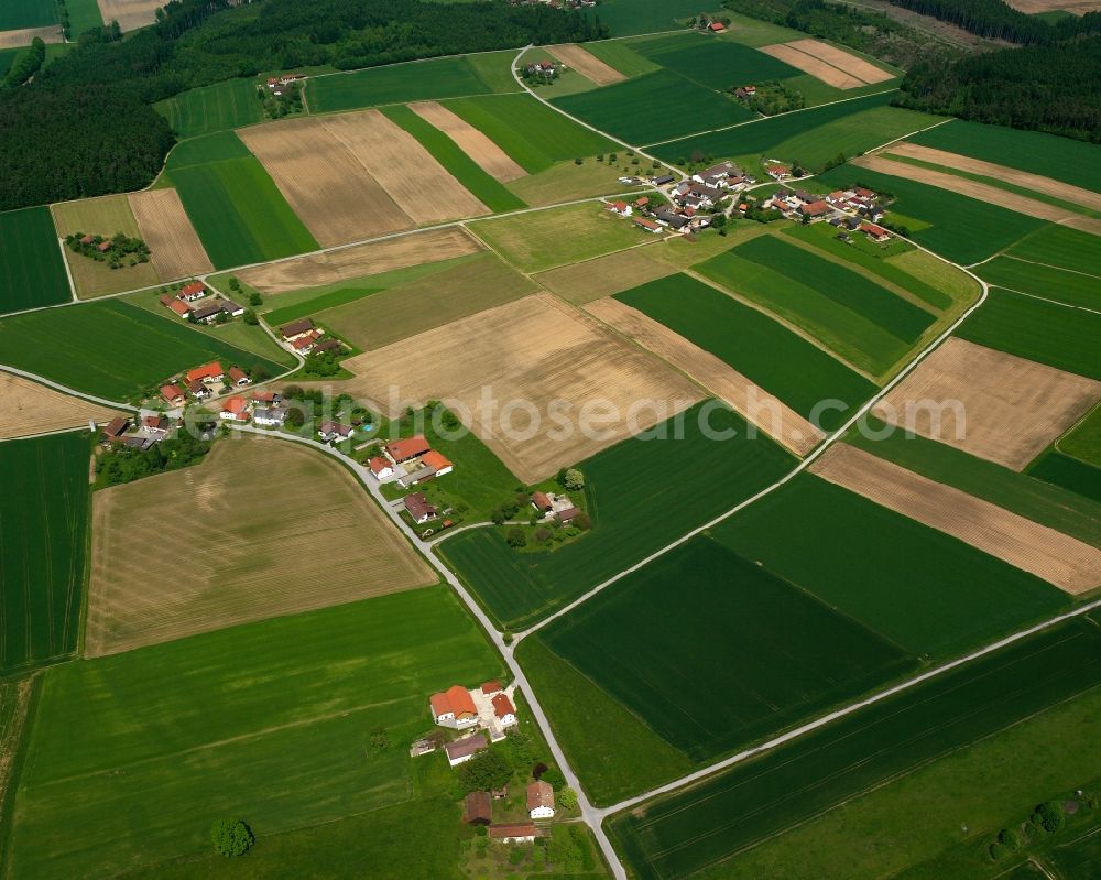 Oberlaimbach from the bird's eye view: Agricultural land and field boundaries surround the settlement area of the village in Oberlaimbach in the state Bavaria, Germany