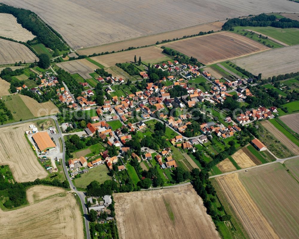 Obermehler from the bird's eye view: Agricultural land and field boundaries surround the settlement area of the village in Obermehler in the state Thuringia, Germany