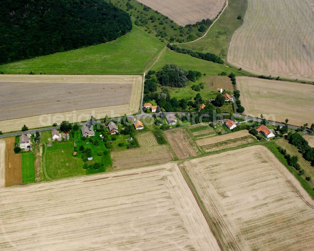 Aerial image Obermehler - Agricultural land and field boundaries surround the settlement area of the village in Obermehler in the state Thuringia, Germany