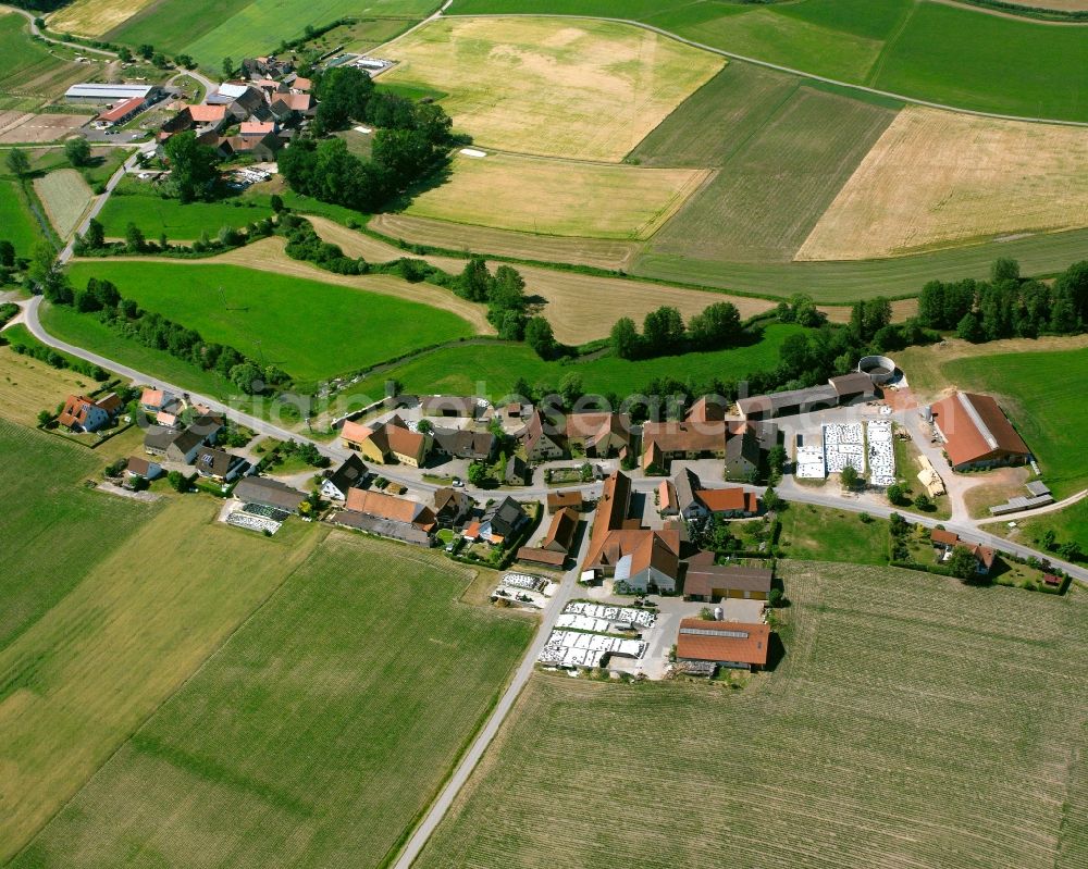 Obermühl from the bird's eye view: Agricultural land and field boundaries surround the settlement area of the village in Obermühl in the state Bavaria, Germany