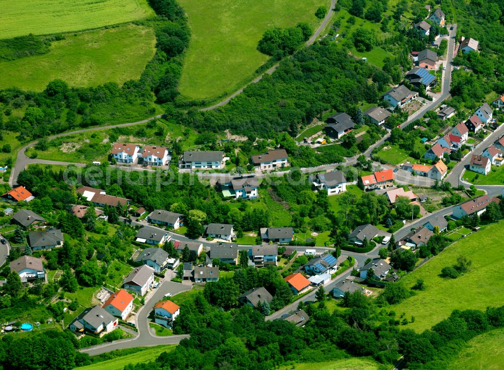 Aerial image Obermoschel - Agricultural land and field boundaries surround the settlement area of the village in Obermoschel in the state Rhineland-Palatinate, Germany