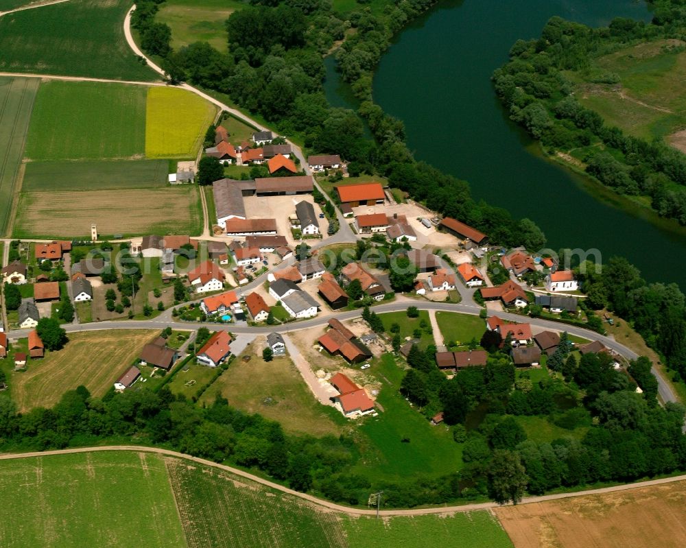 Obermotzing from above - Agricultural land and field boundaries surround the settlement area of the village in Obermotzing in the state Bavaria, Germany