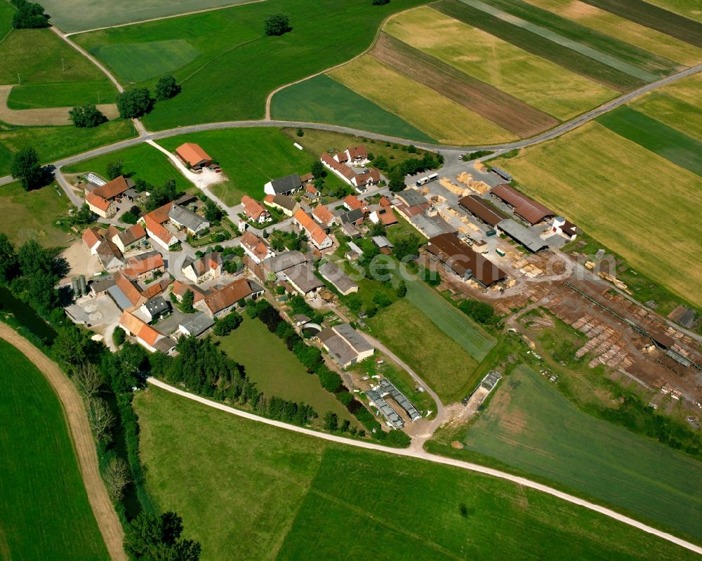 Oberndorf from above - Agricultural land and field boundaries surround the settlement area of the village in Oberndorf in the state Bavaria, Germany