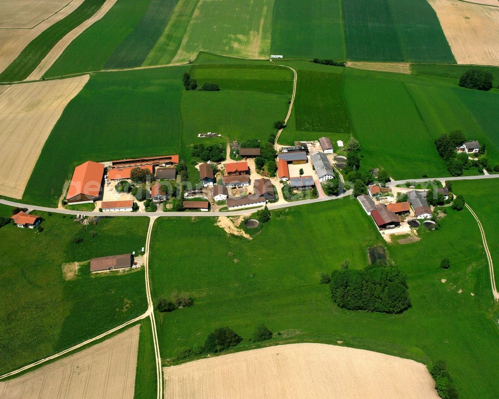 Oberndorf from above - Agricultural land and field boundaries surround the settlement area of the village in Oberndorf in the state Bavaria, Germany