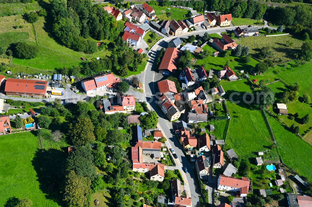 Oberndorf from above - Agricultural land and field boundaries surround the settlement area of the village in Oberndorf in the state Thuringia, Germany