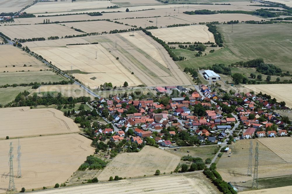 Aerial image Obernissa - Agricultural land and field boundaries surround the settlement area of the village in Obernissa in the state Thuringia, Germany