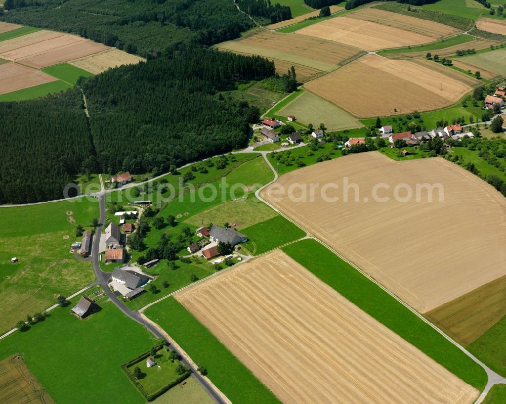 Oberochsenbach from above - Agricultural land and field boundaries surround the settlement area of the village in Oberochsenbach in the state Baden-Wuerttemberg, Germany