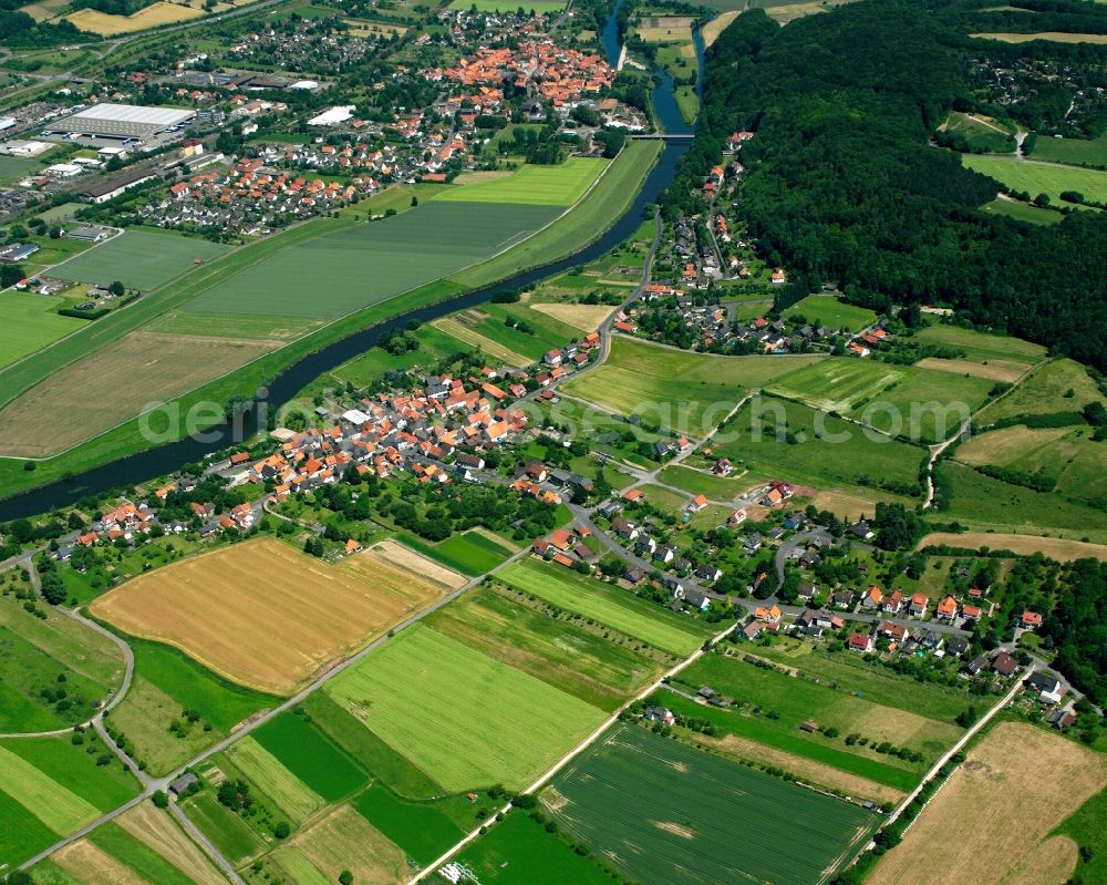 Aerial photograph Oberode - Agricultural land and field boundaries surround the settlement area of the village in Oberode in the state Lower Saxony, Germany